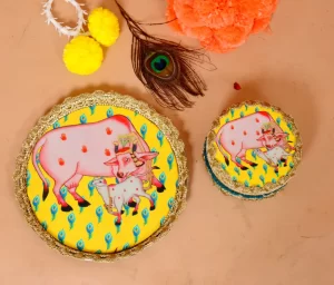 pichwai thali, yellow pichwai thali and sweet box, gift hamper for pichwai festival