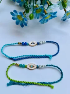 evil eyed oval rakhi, Rakhi Set, best rakhi online, best rakhi, evil eye rakhi, designer rakhi, raksha bandhan rakhi