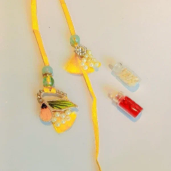 Vintage Festive Thread – Designer Couple Rakhi Gift Set in Yellow Shades for Brother & Bhabhi