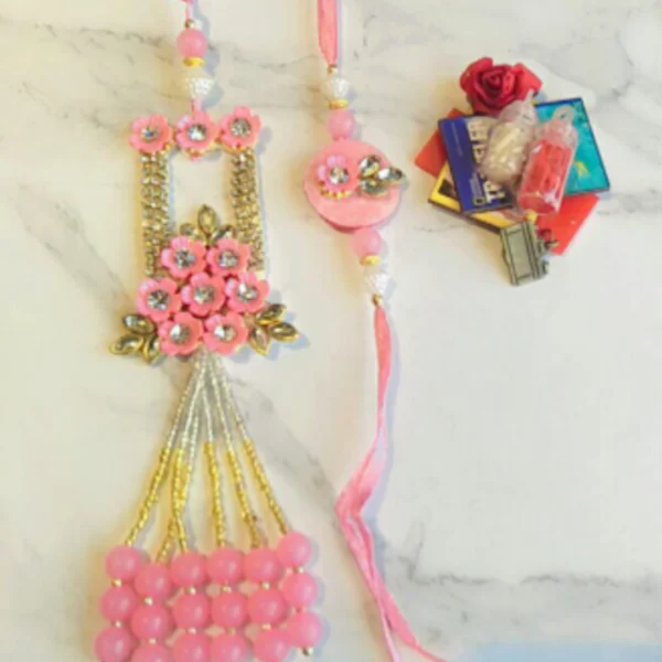 Elegant Thread Duo – Designer Couple Rakhi Gift Set in Pink Shades for Brother & Bhabhi