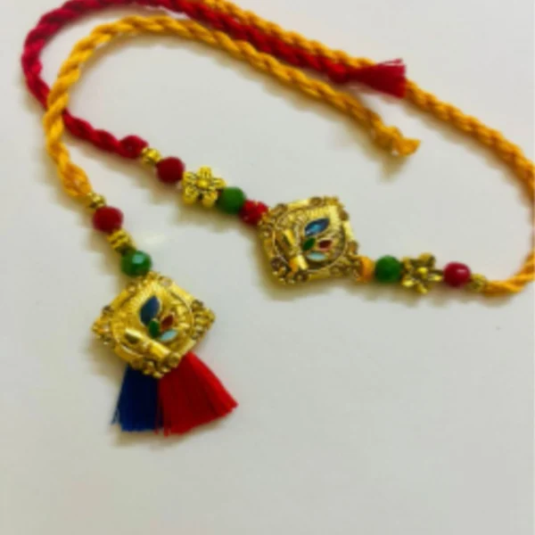 Traditional Love Band – Designer Couple Rakhi Gift Set in Elegant Shades for Brother & Bhabhi