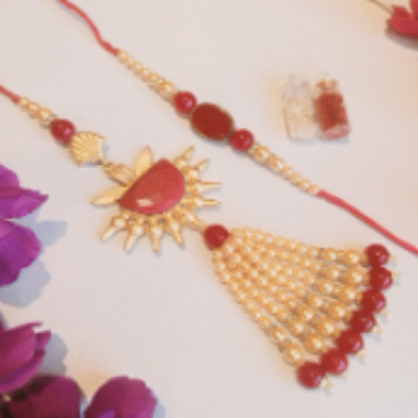 Designer Couple Rakhi Gift Set in Red Shades for Brother & Bhabhi
